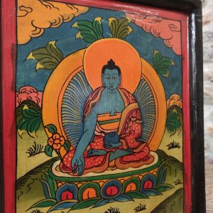 dettaglio di quadro in legno buddha dipinto in blu